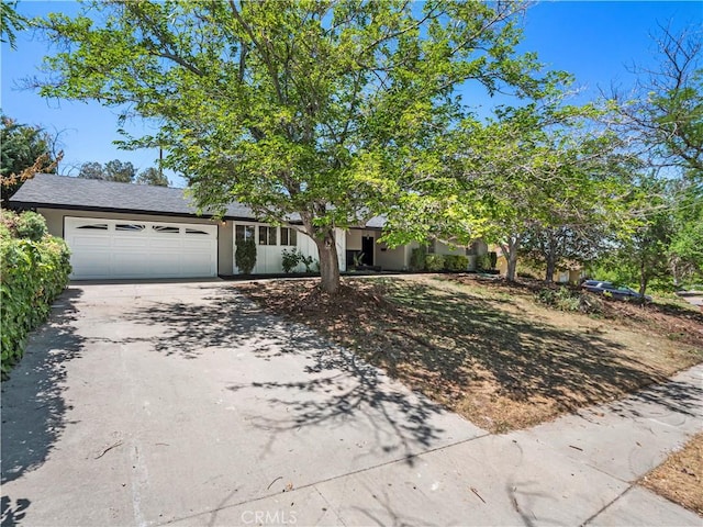 38537 Desert View Dr, Palmdale, CA 93551 - view of front of property with driveway, a garage, and stucco siding