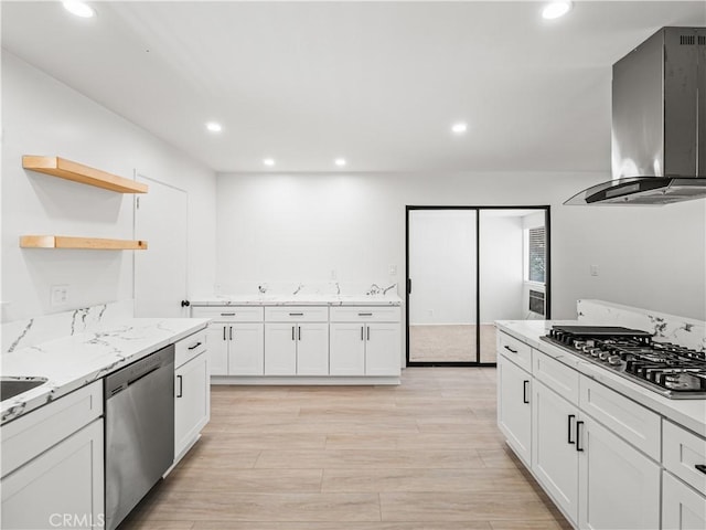 38537 Desert View Dr, Palmdale, CA 93551 - kitchen featuring stainless steel appliances, wall chimney range hood, recessed lighting, white cabinets, and light stone counters