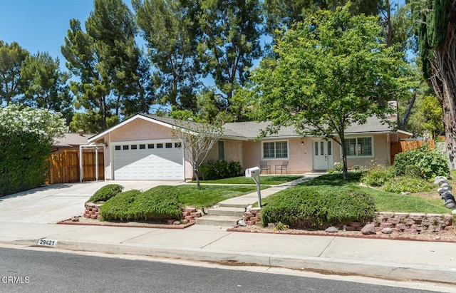 29421 Florabunda Rd, Canyon Country, CA 91387 - ranch-style house featuring an attached garage, driveway, and stucco siding