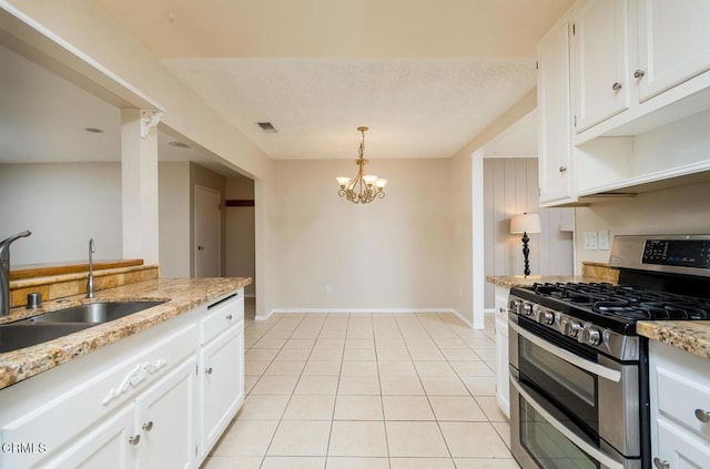 29421 Florabunda Rd, Canyon Country, CA 91387 - kitchen with double oven range, a sink, white cabinetry, a chandelier, and baseboards