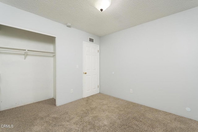 29421 Florabunda Rd, Canyon Country, CA 91387 - unfurnished bedroom featuring carpet, a closet, and a textured ceiling