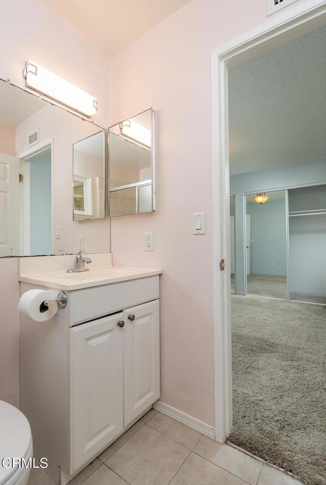 29421 Florabunda Rd, Canyon Country, CA 91387 - bathroom featuring vanity, toilet, tile patterned floors, and baseboards
