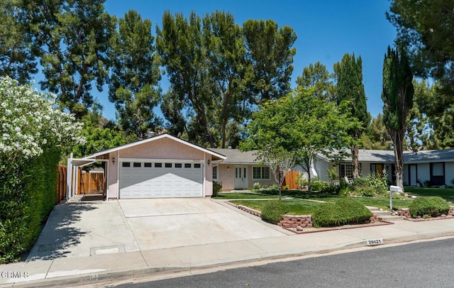 29421 Florabunda Rd, Canyon Country, CA 91387 - ranch-style house featuring an attached garage, concrete driveway, and stucco siding
