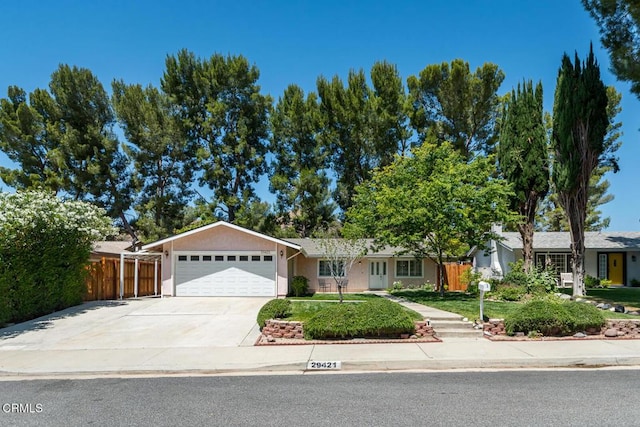 29421 Florabunda Rd, Canyon Country, CA 91387 - ranch-style house featuring an attached garage, driveway, and stucco siding