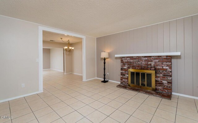 29421 Florabunda Rd, Canyon Country, CA 91387 - unfurnished living room featuring a chandelier, a brick fireplace, light tile patterned floors, and a textured ceiling
