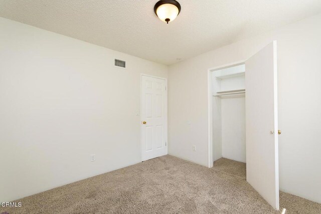 29421 Florabunda Rd, Canyon Country, CA 91387 - unfurnished bedroom featuring carpet and a closet