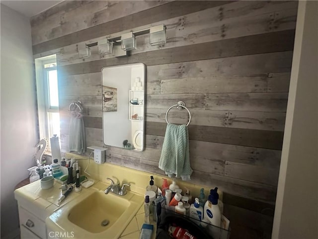 1101 E Ocean Blvd Unit 16, Long Beach, CA 90802 - bathroom featuring wood walls and vanity