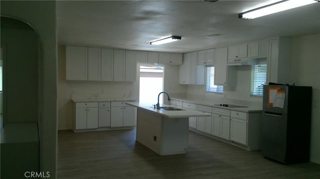 2420 Maine Ave, Long Beach, CA 90806 - kitchen featuring freestanding refrigerator, a sink, wood finished floors, and white cabinets