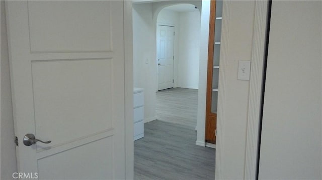 2420 Maine Ave, Long Beach, CA 90806 - corridor with arched walkways, wood finished floors, and baseboards