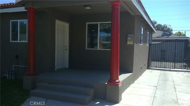 2420 Maine Ave, Long Beach, CA 90806 - property entrance featuring stucco siding and a gate
