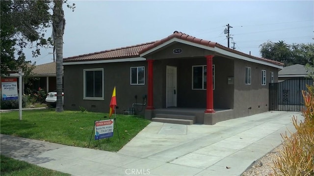 2420 Maine Ave, Long Beach, CA 90806 - view of front of property with crawl space, stucco siding, a tiled roof, a front yard, and a porch