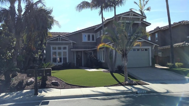 1033 Goldeneye, Carlsbad, CA 92011 - view of front of house featuring concrete driveway, a tiled roof, a front yard, and stucco siding
