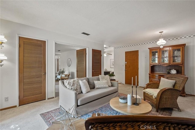 2661 San Jose St, Chico, CA 95973 - living area featuring light colored carpet, baseboards, and a textured ceiling