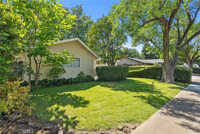 2661 San Jose St, Chico, CA 95973 - view of property exterior featuring stucco siding and a yard