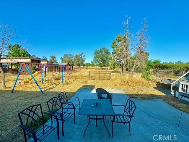 3646 Kirkwood Rd, Corning, CA 96021 - view of patio / terrace with a playground
