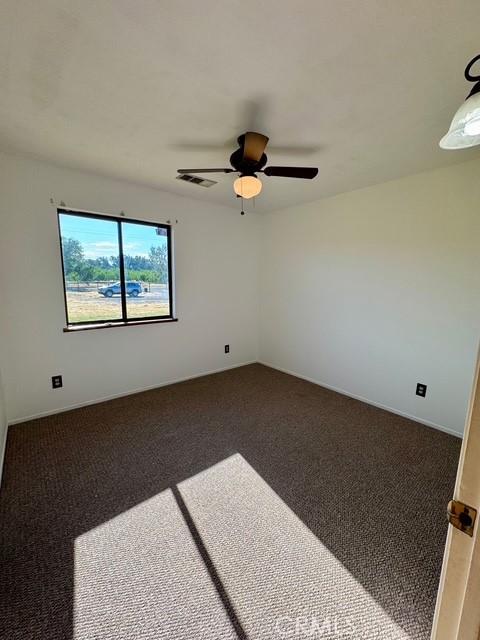 3646 Kirkwood Rd, Corning, CA 96021 - carpeted spare room with ceiling fan