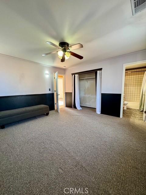 3646 Kirkwood Rd, Corning, CA 96021 - unfurnished bedroom featuring carpet flooring and a ceiling fan