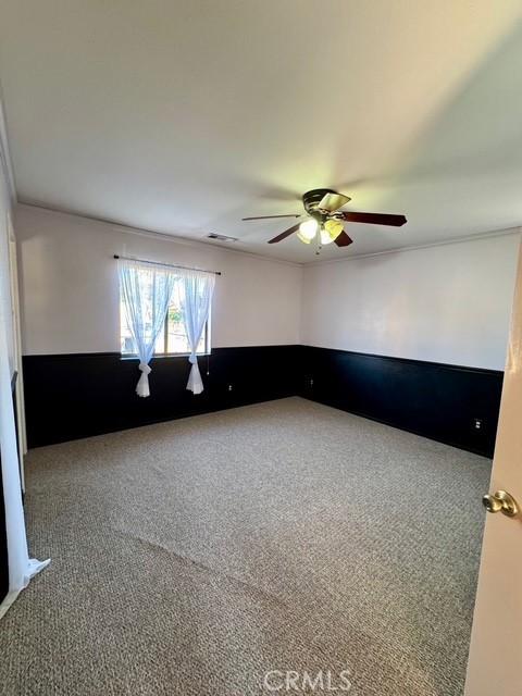 3646 Kirkwood Rd, Corning, CA 96021 - carpeted spare room featuring a ceiling fan