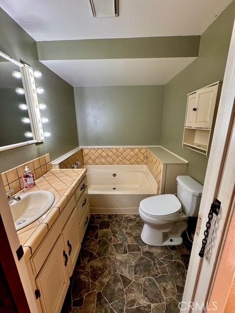 3646 Kirkwood Rd, Corning, CA 96021 - full bath featuring a bath and vanity