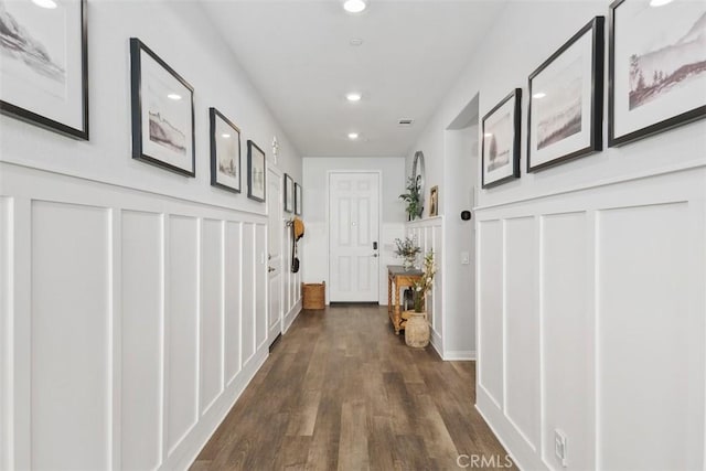 32954 Marin Fields Rd, Winchester, CA 92596 - corridor with a decorative wall, recessed lighting, dark wood-type flooring, and wainscoting