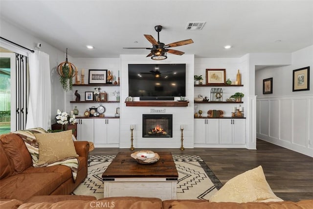 32954 Marin Fields Rd, Winchester, CA 92596 - living area featuring a fireplace, a ceiling fan, wood finished floors, recessed lighting, and a decorative wall