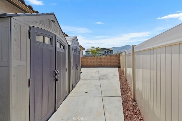 32954 Marin Fields Rd, Winchester, CA 92596 - fenced backyard with a patio area and a mountain view