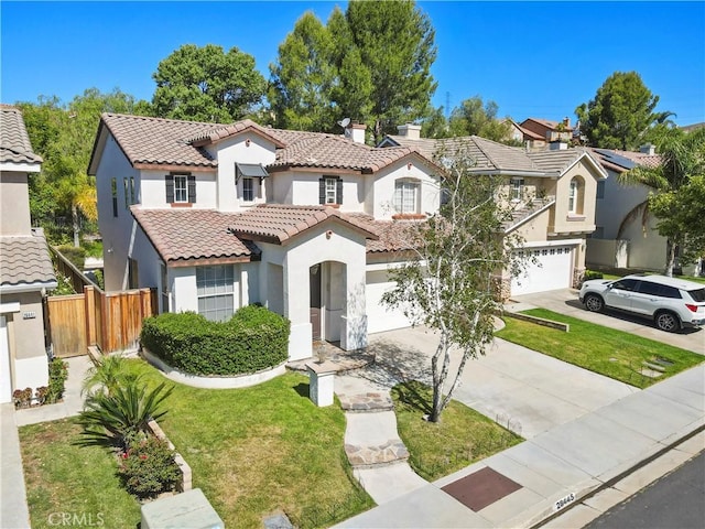 28445 Silverking Trl, Saugus, CA 91390 - mediterranean / spanish-style house with an attached garage, stucco siding, driveway, a tile roof, and a chimney
