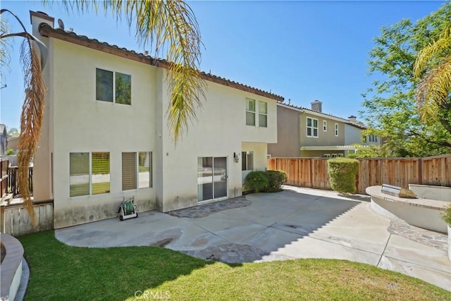 28445 Silverking Trl, Saugus, CA 91390 - rear view of property featuring stucco siding and a patio area