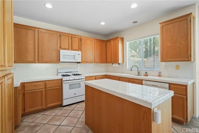28445 Silverking Trl, Saugus, CA 91390 - kitchen featuring white appliances, light tile patterned floors, recessed lighting, tasteful backsplash, and a kitchen island