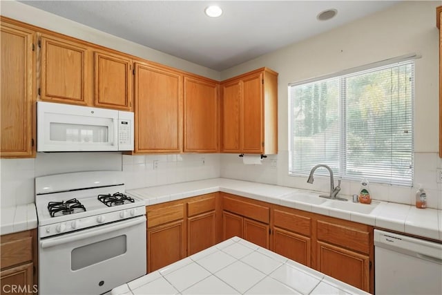 28445 Silverking Trl, Saugus, CA 91390 - kitchen with white appliances, decorative backsplash, healthy amount of natural light, recessed lighting, and tile counters
