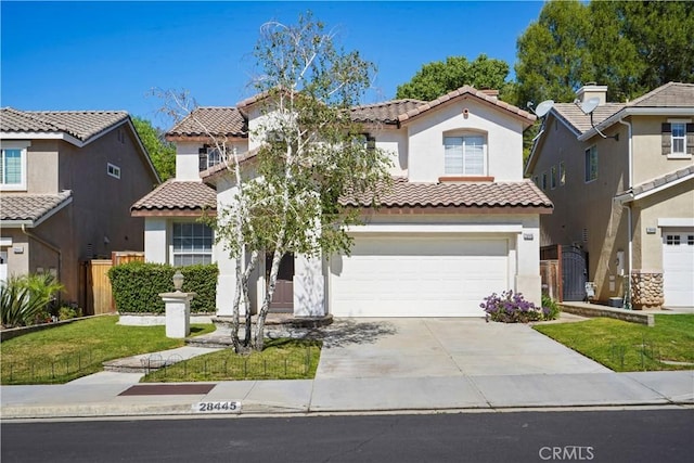 28445 Silverking Trl, Saugus, CA 91390 - mediterranean / spanish-style home with stucco siding, a tiled roof, driveway, and a garage