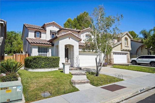28445 Silverking Trl, Saugus, CA 91390 - mediterranean / spanish-style house featuring stucco siding, a tiled roof, driveway, and a garage