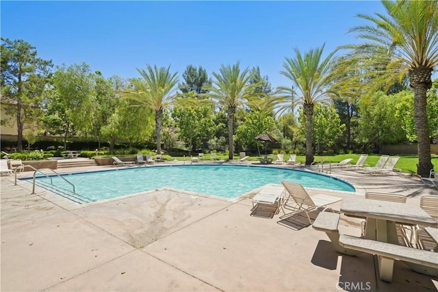 28445 Silverking Trl, Saugus, CA 91390 - community pool featuring a patio and view of wooded area