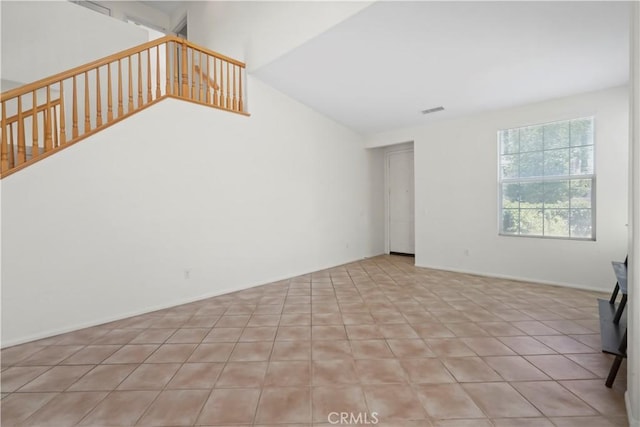 28445 Silverking Trl, Saugus, CA 91390 - unfurnished living room with stairway and vaulted ceiling