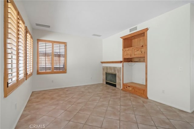 28445 Silverking Trl, Saugus, CA 91390 - unfurnished living room featuring a tile fireplace and light tile patterned floors