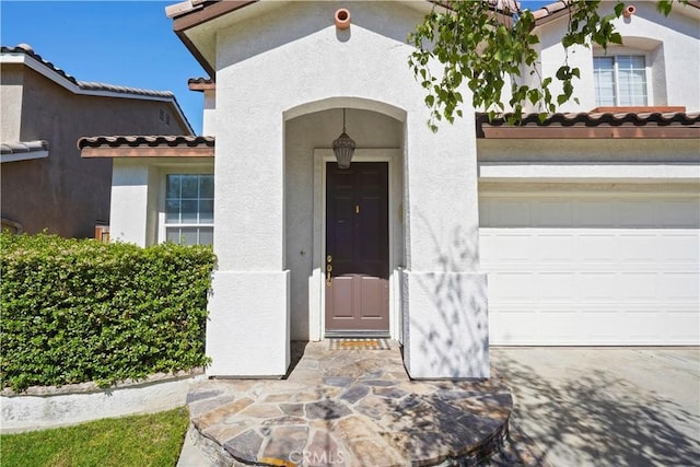 28445 Silverking Trl, Saugus, CA 91390 - entrance to property with a tile roof, stucco siding, and a garage