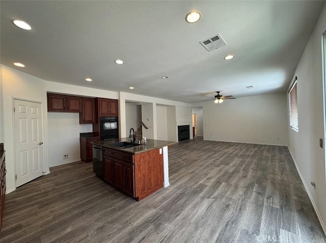 2306 Camellia St, Palmdale, CA 93551 - kitchen featuring black appliances, a sink, dark countertops, ceiling fan, and dark wood-style flooring