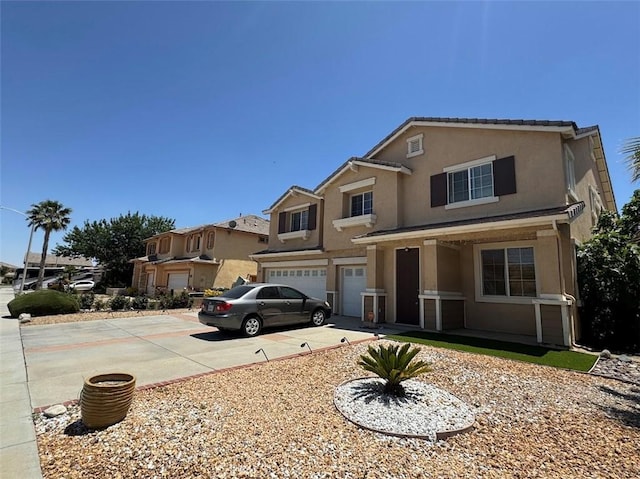 2306 Camellia St, Palmdale, CA 93551 - view of front facade featuring driveway, a garage, and stucco siding