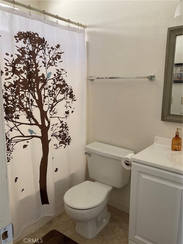 525 Grande Ave Unit D, Nipomo, CA 93444 - bathroom with vanity, tile patterned floors, toilet, and shower / bathtub combination with curtain