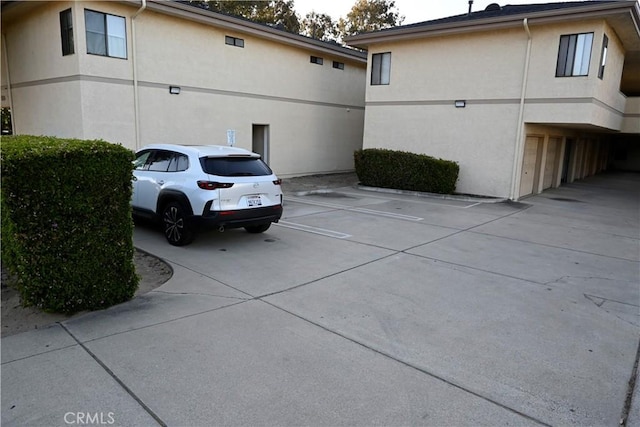 525 Grande Ave Unit D, Nipomo, CA 93444 - view of property exterior with stucco siding and uncovered parking