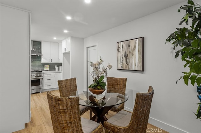 16791 Glenhaven Ln, Huntington Beach, CA 92647 - dining room with recessed lighting, light wood-style floors, and baseboards