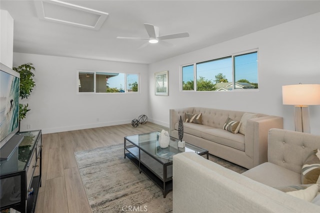 16791 Glenhaven Ln, Huntington Beach, CA 92647 - living area featuring attic access, light wood-style flooring, baseboards, and a ceiling fan