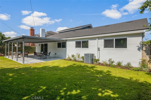 16791 Glenhaven Ln, Huntington Beach, CA 92647 - back of property featuring a yard, cooling unit, a patio area, and a shingled roof