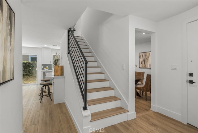 16791 Glenhaven Ln, Huntington Beach, CA 92647 - staircase with wood finished floors, baseboards, and recessed lighting