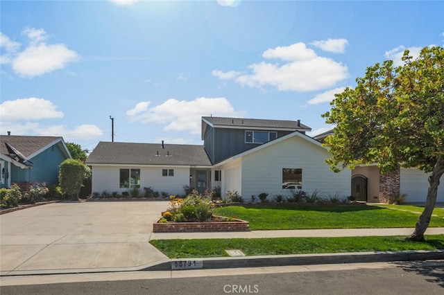 16791 Glenhaven Ln, Huntington Beach, CA 92647 - traditional home with a front yard, concrete driveway, and board and batten siding