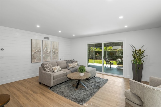 16791 Glenhaven Ln, Huntington Beach, CA 92647 - living area featuring recessed lighting, light wood finished floors, baseboards, and wooden walls