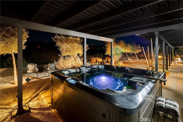 58916 Carmelita Cir, Yucca Valley, CA 92284 - patio at night featuring a hot tub