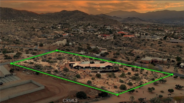 58916 Carmelita Cir, Yucca Valley, CA 92284 - aerial view at dusk of a mountain view, property parcel outlined, and a desert view