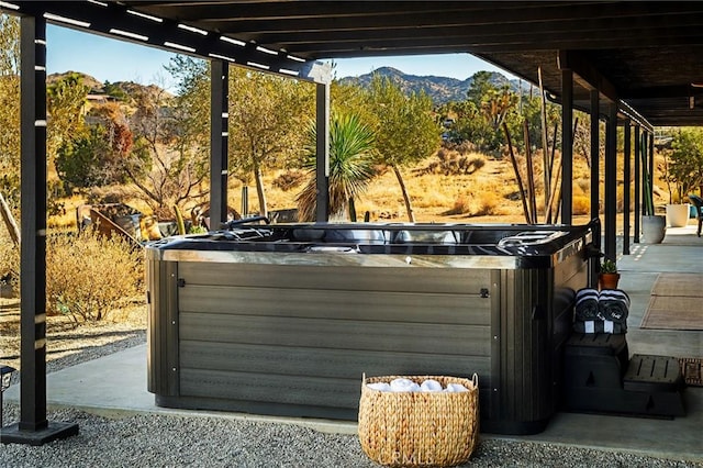 58916 Carmelita Cir, Yucca Valley, CA 92284 - view of patio / terrace featuring a hot tub, a mountain view, and a pergola