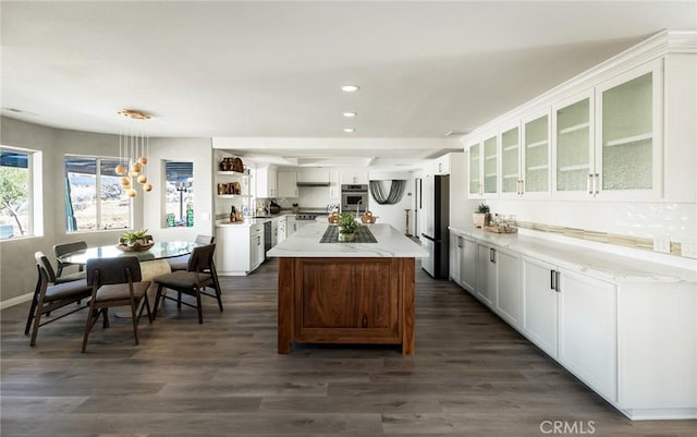 58916 Carmelita Cir, Yucca Valley, CA 92284 - kitchen with stainless steel appliances, a kitchen island, white cabinets, glass insert cabinets, and recessed lighting